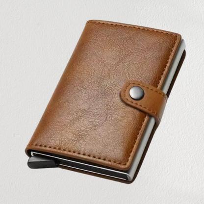 Brown leather wallet with metal clip on a light gray background